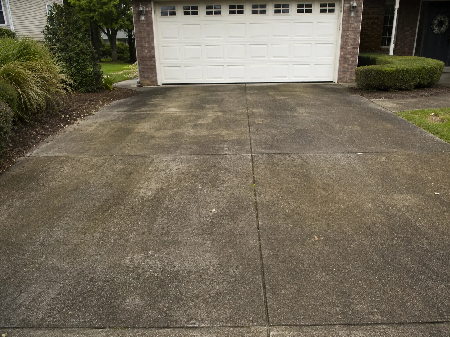 Driveway before pressure washing